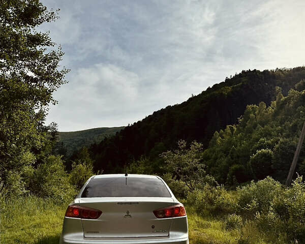 Серый Мицубиси Лансер, объемом двигателя 2 л и пробегом 143 тыс. км за 6850 $, фото 1 на Automoto.ua