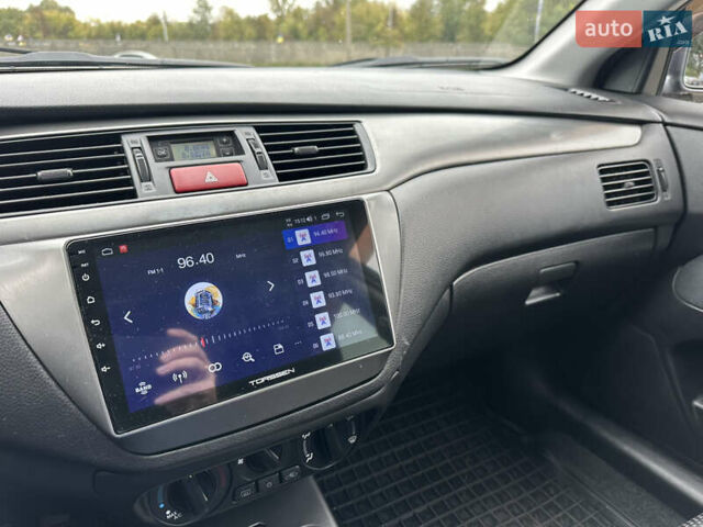 Сірий Міцубісі Lancer, об'ємом двигуна 1.58 л та пробігом 94 тис. км за 6500 $, фото 27 на Automoto.ua