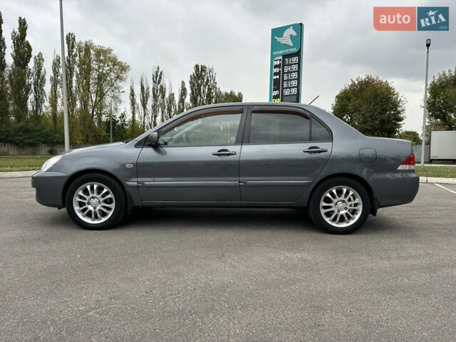 Сірий Міцубісі Lancer, об'ємом двигуна 1.58 л та пробігом 94 тис. км за 6500 $, фото 7 на Automoto.ua