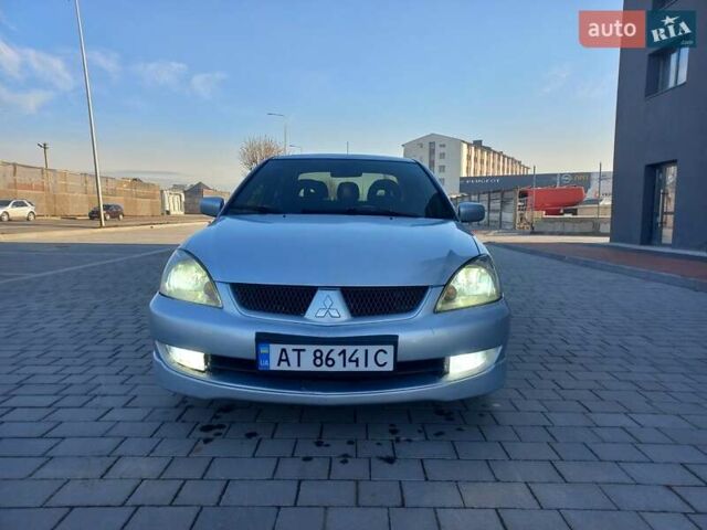 Серый Мицубиси Лансер, объемом двигателя 1.6 л и пробегом 228 тыс. км за 2999 $, фото 6 на Automoto.ua