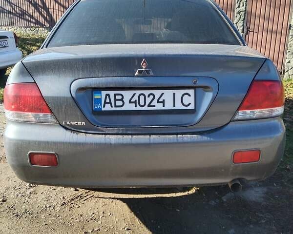 Серый Мицубиси Лансер, объемом двигателя 1.6 л и пробегом 153 тыс. км за 5600 $, фото 3 на Automoto.ua