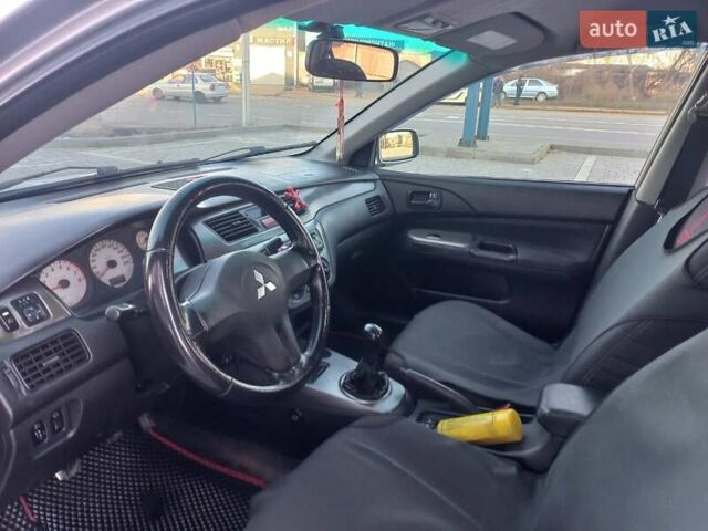 Серый Мицубиси Лансер, объемом двигателя 1.6 л и пробегом 228 тыс. км за 2999 $, фото 22 на Automoto.ua