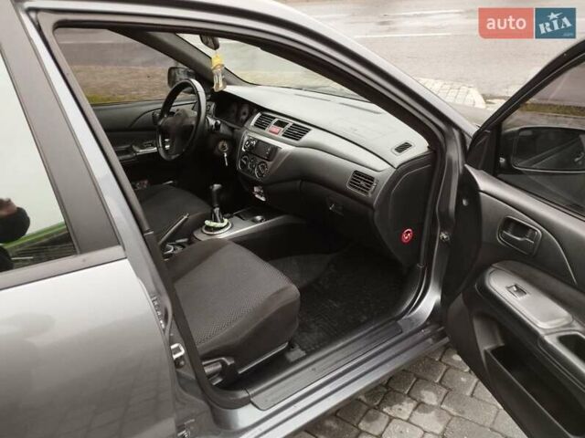 Сірий Міцубісі Lancer, об'ємом двигуна 1.58 л та пробігом 209 тис. км за 2900 $, фото 11 на Automoto.ua