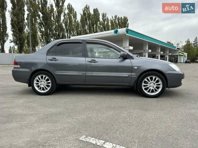 Сірий Міцубісі Lancer, об'ємом двигуна 1.58 л та пробігом 94 тис. км за 6500 $, фото 3 на Automoto.ua