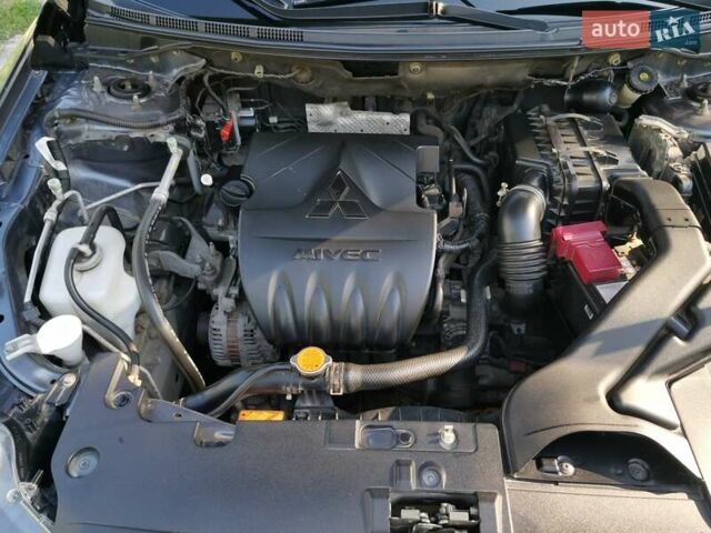 Серый Мицубиси Лансер, объемом двигателя 1.5 л и пробегом 183 тыс. км за 5900 $, фото 8 на Automoto.ua