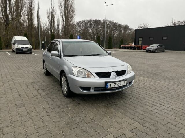 Сірий Міцубісі Lancer, об'ємом двигуна 1.6 л та пробігом 240 тис. км за 4650 $, фото 2 на Automoto.ua
