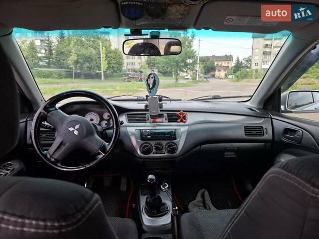 Серый Мицубиси Лансер, объемом двигателя 1.6 л и пробегом 210 тыс. км за 4123 $, фото 4 на Automoto.ua
