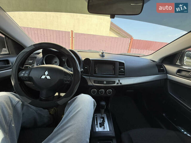 Серый Мицубиси Лансер, объемом двигателя 2 л и пробегом 439 тыс. км за 8000 $, фото 6 на Automoto.ua