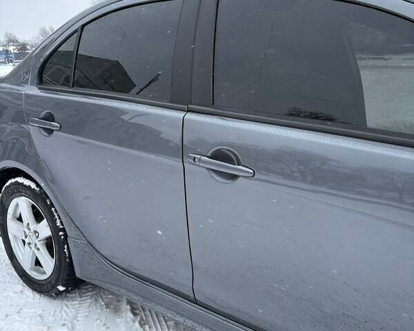 Серый Мицубиси Лансер, объемом двигателя 2 л и пробегом 187 тыс. км за 7000 $, фото 23 на Automoto.ua