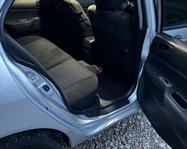 Серый Мицубиси Лансер, объемом двигателя 1.58 л и пробегом 227 тыс. км за 3200 $, фото 14 на Automoto.ua