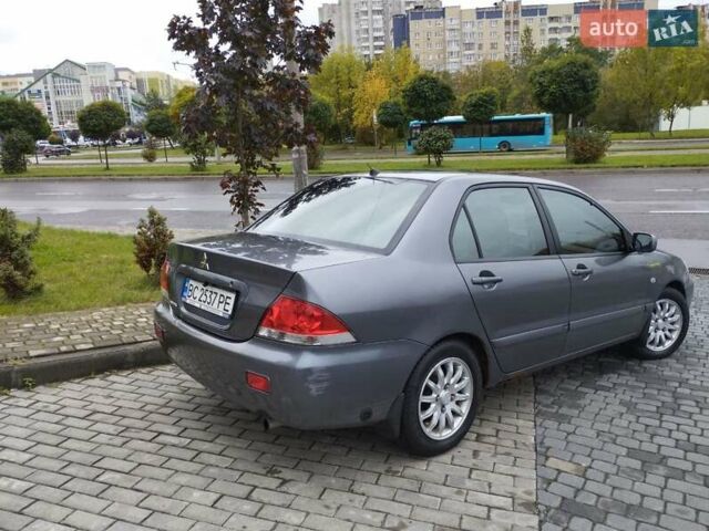 Сірий Міцубісі Lancer, об'ємом двигуна 1.58 л та пробігом 209 тис. км за 2900 $, фото 7 на Automoto.ua