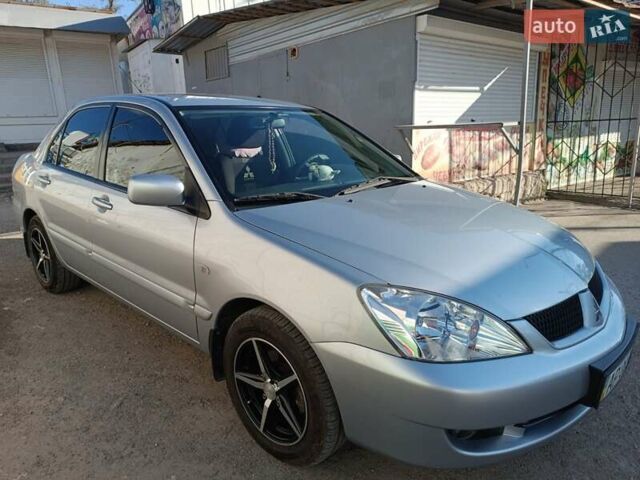 Сірий Міцубісі Lancer, об'ємом двигуна 1.6 л та пробігом 60 тис. км за 7000 $, фото 7 на Automoto.ua