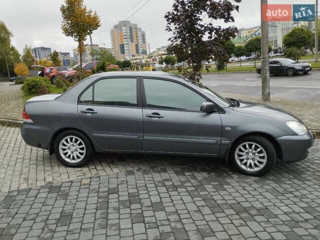 Сірий Міцубісі Lancer, об'ємом двигуна 1.58 л та пробігом 209 тис. км за 2900 $, фото 6 на Automoto.ua