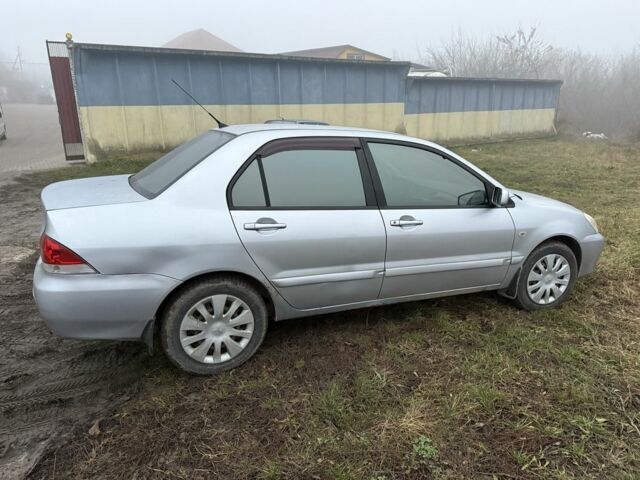 Сірий Міцубісі Lancer, об'ємом двигуна 1.6 л та пробігом 230 тис. км за 3400 $, фото 1 на Automoto.ua