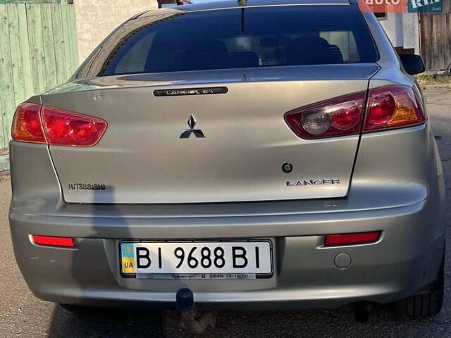 Серый Мицубиси Лансер, объемом двигателя 2 л и пробегом 305 тыс. км за 6500 $, фото 9 на Automoto.ua