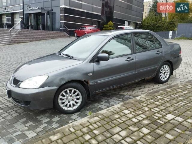 Сірий Міцубісі Lancer, об'ємом двигуна 1.58 л та пробігом 209 тис. км за 2900 $, фото 8 на Automoto.ua