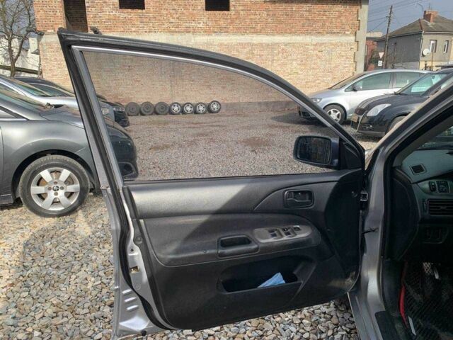 Серый Мицубиси Лансер, объемом двигателя 1.6 л и пробегом 227 тыс. км за 3599 $, фото 8 на Automoto.ua