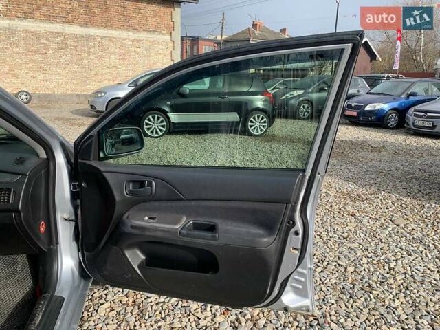 Серый Мицубиси Лансер, объемом двигателя 1.58 л и пробегом 227 тыс. км за 3599 $, фото 11 на Automoto.ua