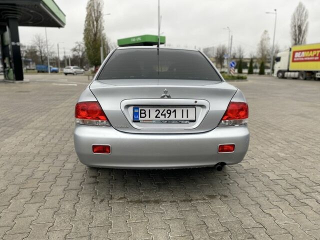Сірий Міцубісі Lancer, об'ємом двигуна 1.6 л та пробігом 240 тис. км за 4650 $, фото 5 на Automoto.ua