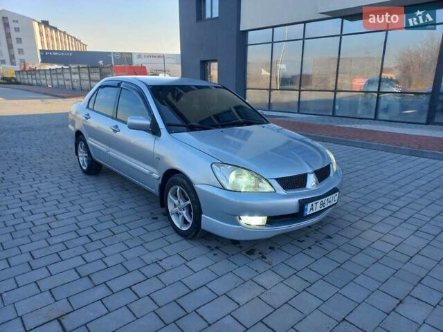 Серый Мицубиси Лансер, объемом двигателя 1.6 л и пробегом 228 тыс. км за 2999 $, фото 8 на Automoto.ua