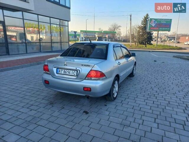 Серый Мицубиси Лансер, объемом двигателя 1.6 л и пробегом 228 тыс. км за 2999 $, фото 14 на Automoto.ua
