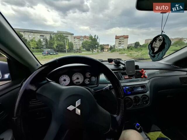 Серый Мицубиси Лансер, объемом двигателя 1.6 л и пробегом 210 тыс. км за 4123 $, фото 8 на Automoto.ua