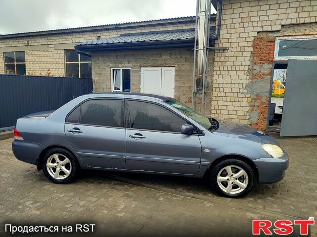 Сірий Міцубісі Lancer, об'ємом двигуна 1.6 л та пробігом 197 тис. км за 3600 $, фото 3 на Automoto.ua