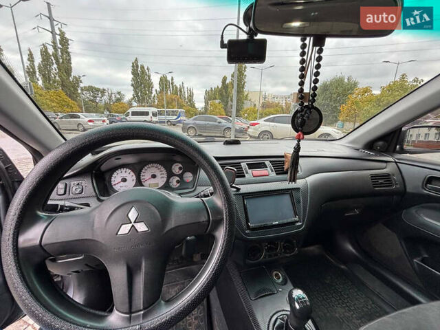 Серый Мицубиси Лансер, объемом двигателя 1.6 л и пробегом 218 тыс. км за 5100 $, фото 19 на Automoto.ua