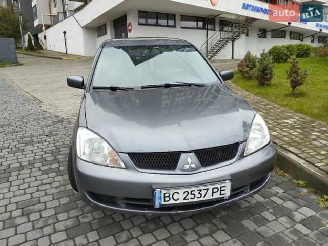 Сірий Міцубісі Lancer, об'ємом двигуна 1.58 л та пробігом 209 тис. км за 2900 $, фото 5 на Automoto.ua