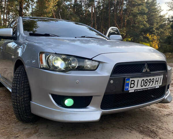 Серый Мицубиси Лансер, объемом двигателя 2 л и пробегом 239 тыс. км за 6999 $, фото 39 на Automoto.ua