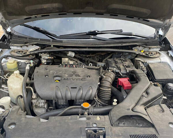 Серый Мицубиси Лансер, объемом двигателя 2 л и пробегом 239 тыс. км за 6999 $, фото 16 на Automoto.ua