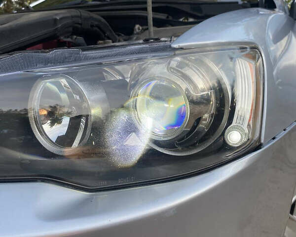 Серый Мицубиси Лансер, объемом двигателя 2 л и пробегом 239 тыс. км за 6999 $, фото 14 на Automoto.ua