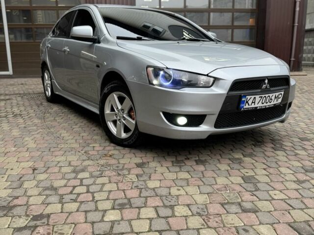 Серый Мицубиси Лансер, объемом двигателя 2 л и пробегом 220 тыс. км за 7450 $, фото 1 на Automoto.ua