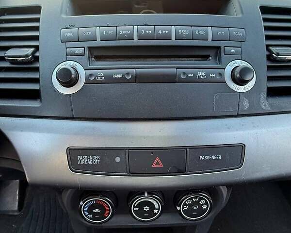 Серый Мицубиси Лансер, объемом двигателя 2 л и пробегом 272 тыс. км за 4499 $, фото 9 на Automoto.ua