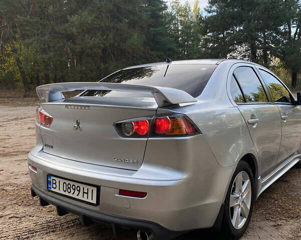 Серый Мицубиси Лансер, объемом двигателя 2 л и пробегом 239 тыс. км за 6999 $, фото 13 на Automoto.ua