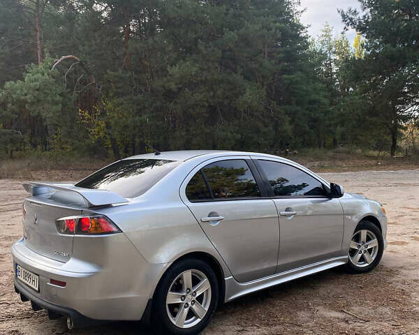 Серый Мицубиси Лансер, объемом двигателя 2 л и пробегом 239 тыс. км за 6999 $, фото 2 на Automoto.ua