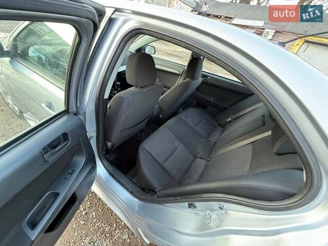 Серый Мицубиси Лансер, объемом двигателя 2 л и пробегом 272 тыс. км за 4499 $, фото 11 на Automoto.ua