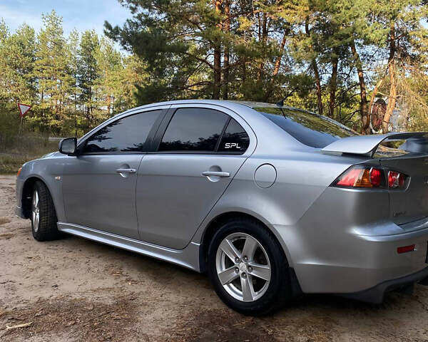 Серый Мицубиси Лансер, объемом двигателя 2 л и пробегом 239 тыс. км за 6999 $, фото 26 на Automoto.ua