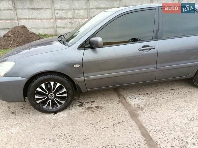 Серый Мицубиси Лансер, объемом двигателя 1.58 л и пробегом 159 тыс. км за 6000 $, фото 1 на Automoto.ua