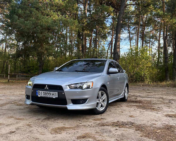 Серый Мицубиси Лансер, объемом двигателя 2 л и пробегом 239 тыс. км за 6999 $, фото 25 на Automoto.ua