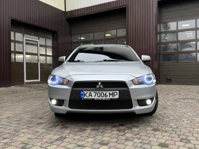 Серый Мицубиси Лансер, объемом двигателя 2 л и пробегом 220 тыс. км за 7450 $, фото 5 на Automoto.ua