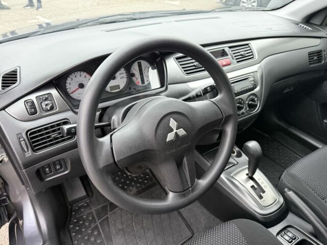 Сірий Міцубісі Lancer, об'ємом двигуна 1.6 л та пробігом 62 тис. км за 7300 $, фото 23 на Automoto.ua