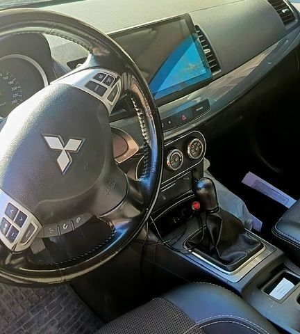 Серый Мицубиси Лансер, объемом двигателя 2 л и пробегом 187 тыс. км за 7500 $, фото 4 на Automoto.ua