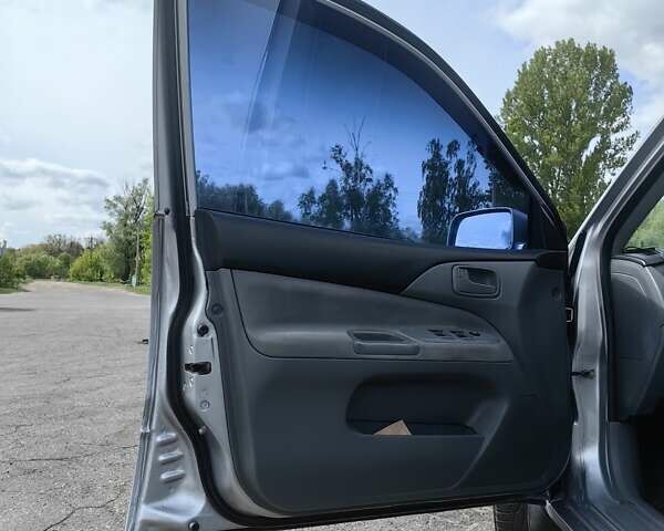 Сірий Міцубісі Lancer, об'ємом двигуна 1.6 л та пробігом 300 тис. км за 5700 $, фото 11 на Automoto.ua