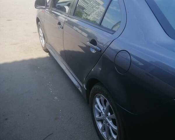 Сірий Міцубісі Lancer, об'ємом двигуна 2 л та пробігом 263 тис. км за 7000 $, фото 5 на Automoto.ua