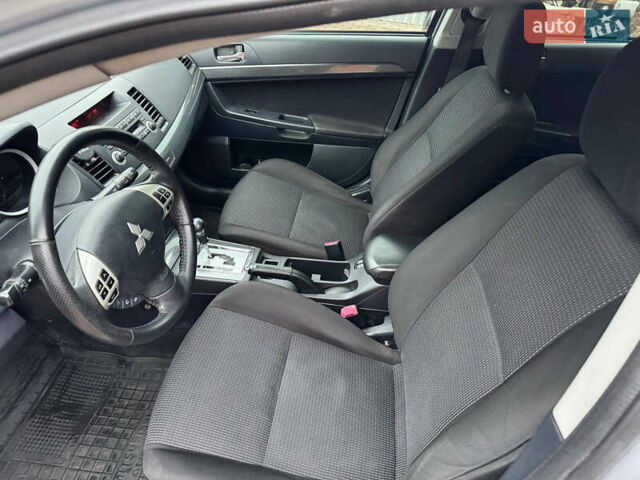 Сірий Міцубісі Lancer, об'ємом двигуна 2 л та пробігом 173 тис. км за 7200 $, фото 25 на Automoto.ua