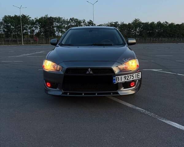 Серый Мицубиси Лансер, объемом двигателя 2 л и пробегом 191 тыс. км за 7900 $, фото 1 на Automoto.ua