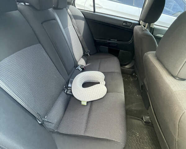 Мицубиси Лансер 2011 в Львове на Automoto.ua Серый Мицубиси Лансер, объемом двигателя 2 л и пробегом 104 тыс. км за 10500 $, фото 48 на Automoto.ua