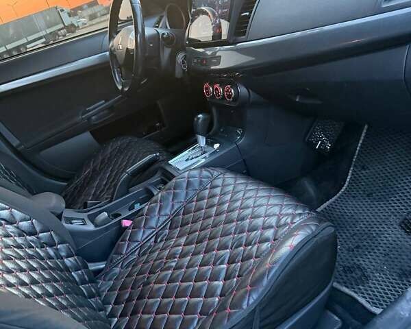 Серый Мицубиси Лансер, объемом двигателя 2 л и пробегом 191 тыс. км за 7900 $, фото 9 на Automoto.ua