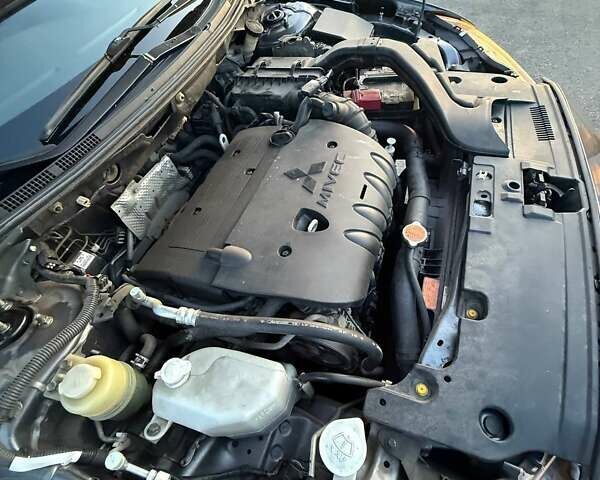 Серый Мицубиси Лансер, объемом двигателя 2 л и пробегом 191 тыс. км за 7900 $, фото 4 на Automoto.ua